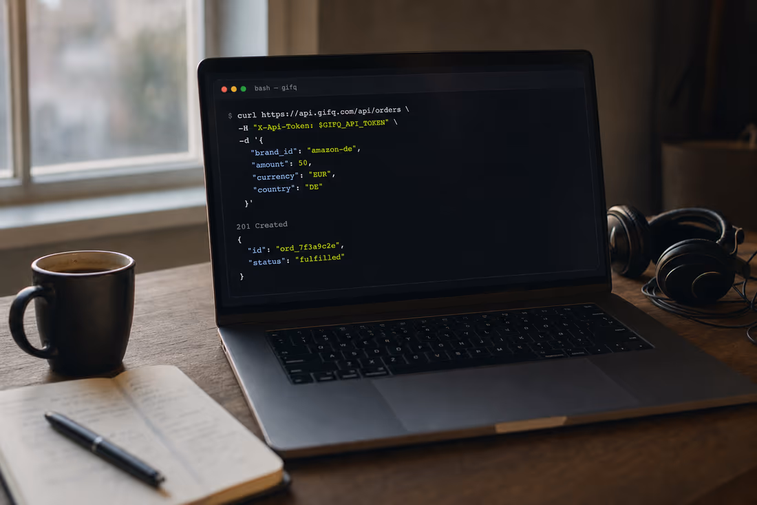 A laptop on a desk showing a terminal with a POST /api/orders request and a 201 Created response
